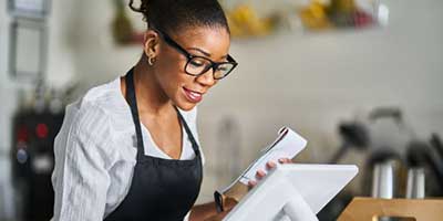 Woman using merchant services for her business
