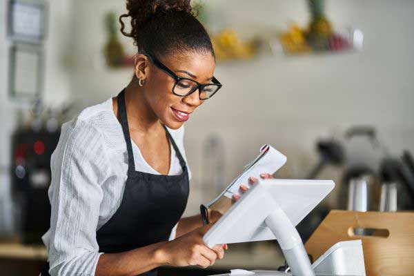 Woman using merchant services for her business